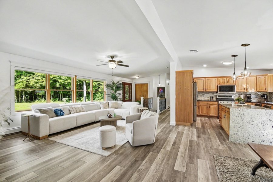Open living room beside the renovated kitchen with center island