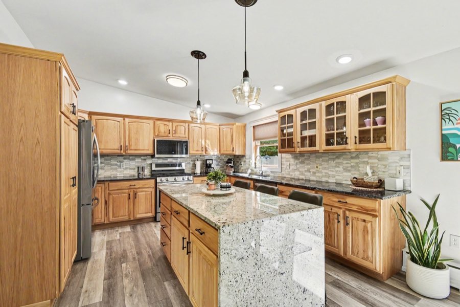 Alternate view of the renovated center-island kitchen and appliances