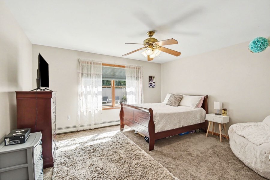 Second view of a secondary bedroom with window and closet