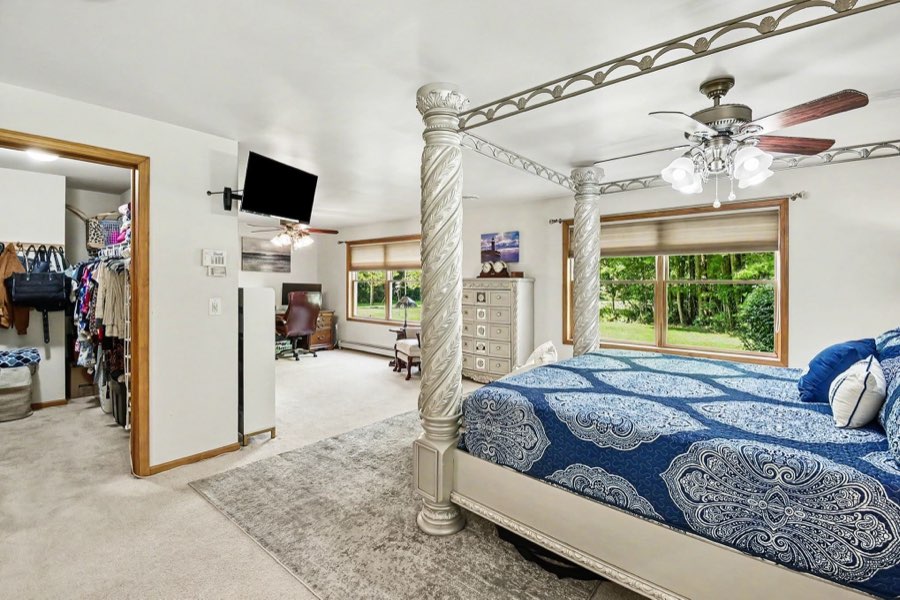 Primary bedroom with access to a walk-in closet