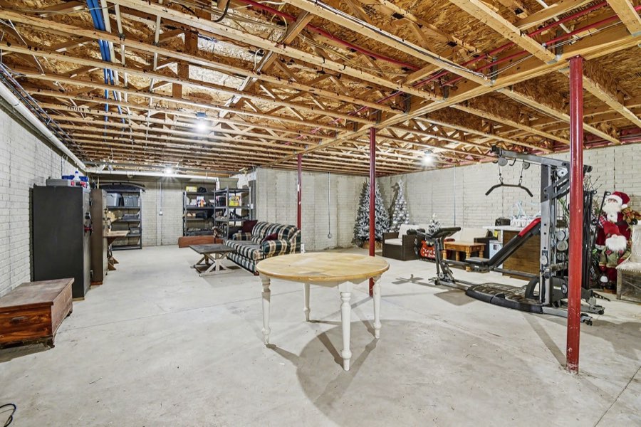 Second view across the full unfinished basement